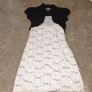 Girl’s black and white dress.
